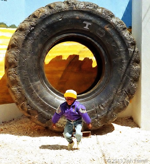 Lusaka agricultural show - Boy and copper belt truck tyre